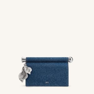 Holly Pochette ornée d'un pendentif métallique - Denim bleu
